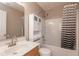Bathroom with a shower-tub combo, sink with vanity, and extra storage above the toilet at 2523 Gammon Dr, Indianapolis, IN 46234