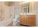 Bathroom featuring a shower-tub combo, modern toilet, and sink with vanity at 2523 Gammon Dr, Indianapolis, IN 46234