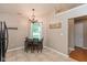 Cozy breakfast nook featuring a chandelier, tiled floor, and quaint window at 2523 Gammon Dr, Indianapolis, IN 46234