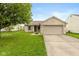 Charming single-story home featuring a two-car garage, brick facade, and well-maintained front lawn at 2523 Gammon Dr, Indianapolis, IN 46234