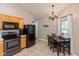 Cozy kitchen with tiled floors, black appliances, oak cabinets, and breakfast nook at 2523 Gammon Dr, Indianapolis, IN 46234