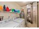 Functional laundry room with modern appliances, shelving, and utility connections at 2523 Gammon Dr, Indianapolis, IN 46234