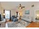 Inviting living room with a ceiling fan, hardwood floors, and neutral decor at 2523 Gammon Dr, Indianapolis, IN 46234