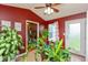 Bright sunroom offering an abundance of light and access to other rooms of the house at 2523 Gammon Dr, Indianapolis, IN 46234