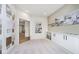 Bright entryway featuring custom built-ins, decorative wall art, and a glimpse into the home's interior at 2717 Penn Ave, Plainfield, IN 46168