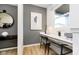 Stylish home office showcasing a built-in desk, modern decor, and a well-lit workspace at 2717 Penn Ave, Plainfield, IN 46168