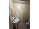 Small bathroom featuring a pedestal sink, toilet, medicine cabinet, and neutral-colored walls at 2871 N Talley Rd, Columbus, IN 47203