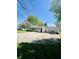 View of the house with large garage, driveway with vehicle, and well maintained lawn at 2871 N Talley Rd, Columbus, IN 47203