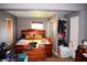Cozy bedroom with natural light, closet, and neutral walls at 321 Harlan St, Indianapolis, IN 46201