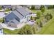 Aerial view of a home with a backyard patio, outdoor fireplace and manicured lawn at 3387 Keystone Pass, Plainfield, IN 46168