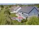 Aerial view of a backyard featuring a firepit, patio, outdoor seating and lush green landscaping at 3387 Keystone Pass, Plainfield, IN 46168
