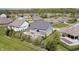 Expansive backyard with a patio, mature trees, and a glimpse of the neighborhood at 3387 Keystone Pass, Plainfield, IN 46168