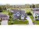 Beautiful aerial view of a two story home featuring a large manicured front yard at 3387 Keystone Pass, Plainfield, IN 46168