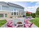 Beautiful backyard featuring a large patio with a fire pit and outdoor seating area at 3387 Keystone Pass, Plainfield, IN 46168