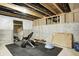 Workout area in basement with mirror, weights, bench and rubber mat flooring at 3387 Keystone Pass, Plainfield, IN 46168