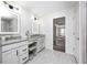 Bright bathroom featuring double vanity, modern lighting, and elegant finishes at 3387 Keystone Pass, Plainfield, IN 46168