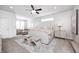 Elegant bedroom with tufted headboard, accent seating, and stylish decor at 3387 Keystone Pass, Plainfield, IN 46168