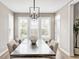 Sunlit dining room featuring a large table with seating for eight at 3387 Keystone Pass, Plainfield, IN 46168