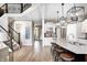 Bright, open kitchen featuring granite countertops and modern light fixtures at 3387 Keystone Pass, Plainfield, IN 46168