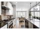 Beautiful eat-in kitchen with modern stainless steel appliances and chic bar stool seating at 3387 Keystone Pass, Plainfield, IN 46168