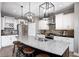 Well-appointed kitchen featuring granite countertops, island seating, and stainless-steel appliances at 3387 Keystone Pass, Plainfield, IN 46168