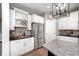 Tasteful kitchen showcasing stainless steel appliances and wine rack at 3387 Keystone Pass, Plainfield, IN 46168