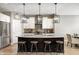 Stylish kitchen with granite counters, stainless appliances, and trendy lighting at 3387 Keystone Pass, Plainfield, IN 46168
