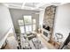 Spacious living room with stone fireplace, coffered ceiling, and modern decor at 3387 Keystone Pass, Plainfield, IN 46168
