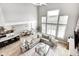 Bright living room showcasing tall windows, an open floor plan and light gray decor at 3387 Keystone Pass, Plainfield, IN 46168