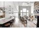 Inviting living room open to kitchen and dining area with soaring ceilings and clerestory windows at 3387 Keystone Pass, Plainfield, IN 46168