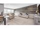 Cozy living room featuring a decorative wood accent wall and plush furniture at 3387 Keystone Pass, Plainfield, IN 46168