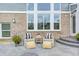 Cozy patio area with chairs, side table and potted plants, perfect for outdoor relaxation at 3387 Keystone Pass, Plainfield, IN 46168
