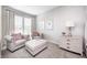Comfortable sitting area with elegant chairs, ottoman, and stylish decor at 3387 Keystone Pass, Plainfield, IN 46168