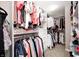 Spacious walk-in closet with built in shelving and organizational system for easy clothing storage at 3387 Keystone Pass, Plainfield, IN 46168