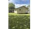 Back exterior of home has new door and a large backyard at 346 Gimber Ct, Indianapolis, IN 46225