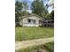 Charming single-story home with a lush lawn and a convenient carport at 346 Gimber Ct, Indianapolis, IN 46225