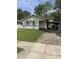 Cozy single-story home features a carport and a well-maintained front lawn at 346 Gimber Ct, Indianapolis, IN 46225