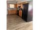 Kitchen featuring wood cabinets and black appliances at 346 Gimber Ct, Indianapolis, IN 46225