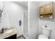 Well-lit bathroom featuring a walk-in shower, granite vanity, and wood storage cabinet at 3710 E 750 S, Lebanon, IN 46052