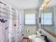 Well-lit bathroom featuring a vanity with a granite countertop, toilet, and shower at 3710 E 750 S, Lebanon, IN 46052