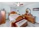 Traditional bedroom boasts wood furniture, and neutral walls at 3710 E 750 S, Lebanon, IN 46052