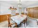 Traditional dining room with wood paneling, neutral carpet, and classic furnishings at 3710 E 750 S, Lebanon, IN 46052