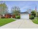 Attractive brick home with a well-maintained lawn, long driveway, and a two-car garage at 3710 E 750 S, Lebanon, IN 46052