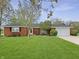 Charming brick home featuring a well-manicured lawn and a two-car garage at 3710 E 750 S, Lebanon, IN 46052