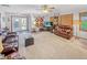 The well-lit living room features a leather sofa, a side table, and exterior access at 3710 E 750 S, Lebanon, IN 46052