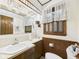 Unique bathroom with pendant lights, wood paneling, and a large mirror at 3824 Oakwood Blvd, Anderson, IN 46011