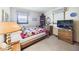 A cozy bedroom with hardwood floors, comfy bed and windows with natural light at 3824 Oakwood Blvd, Anderson, IN 46011