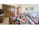 A cozy bedroom with hardwood floors, comfy bed and closet at 3824 Oakwood Blvd, Anderson, IN 46011