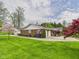 Exterior view of the property featuring a brick facade and an attached two-car garage at 3824 Oakwood Blvd, Anderson, IN 46011