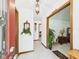 An entry hall with wood trim and ceramic tile and with view to adjoining rooms at 3824 Oakwood Blvd, Anderson, IN 46011